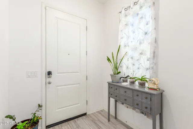 a living room with furniture a dining table and chairs