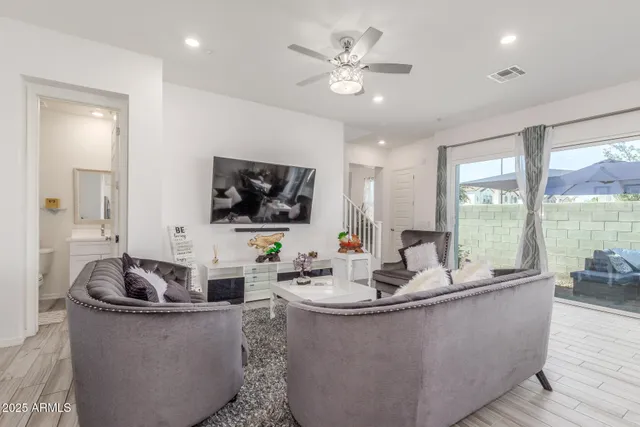 a kitchen with sink and mirror