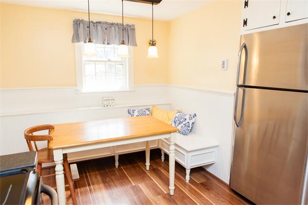33 Laurel Road Bolton, MA 01740 - Photo 15 of 30 a room with a table and a chandelier