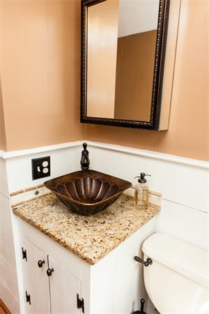 33 Laurel Road Bolton, MA 01740 - Photo 16 of 30 a bathroom with a granite countertop sink and a mirror