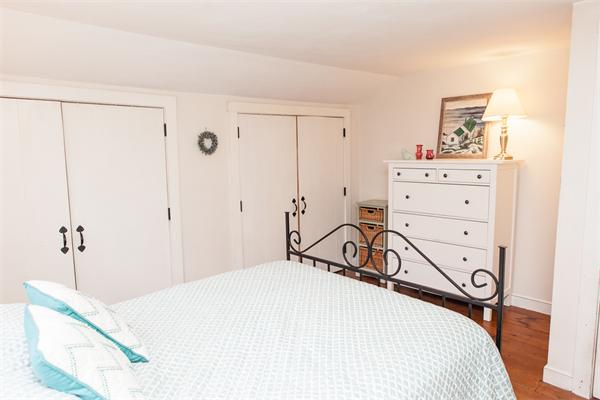 33 Laurel Road Bolton, MA 01740 - Photo 21 of 30 a bedroom with a bed and a dresser