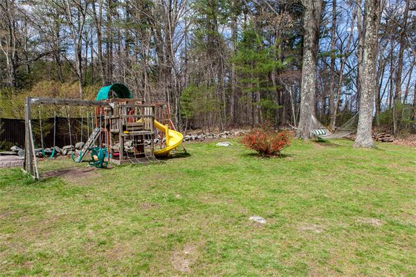 33 Laurel Road Bolton, MA 01740 - Photo 26 of 30 a childrens park with lots of swings and slides