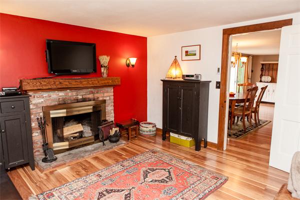 33 Laurel Road Bolton, MA 01740 - Photo 9 of 30 a living room with furniture and a fireplace