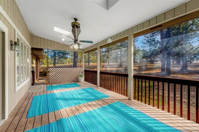 a view of outdoor space with deck and furniture