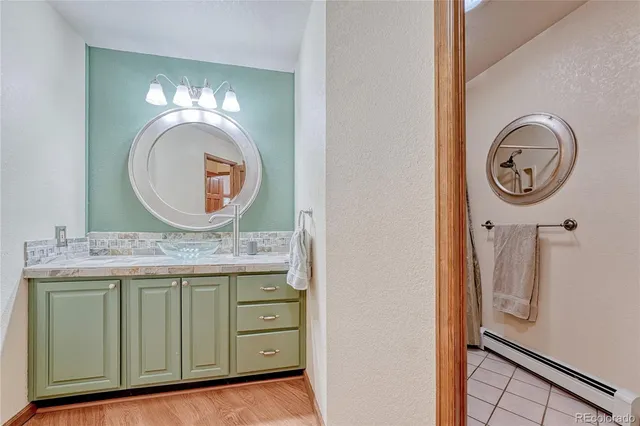 a bathroom with a mirror and a sink