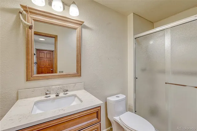 a white toilet sitting next to a bathroom sink