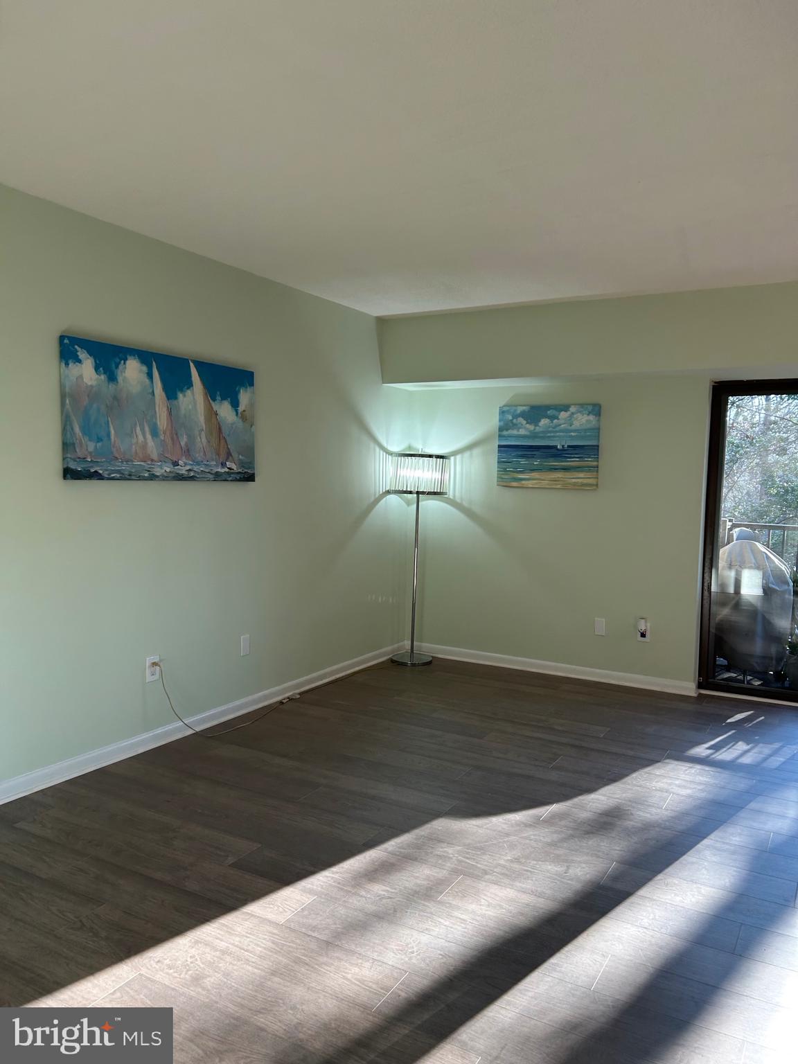 11609 Stoneview Square, Unit 11C Reston, VA 20191 - Photo 16 of 23 a view of an empty room with wooden floor