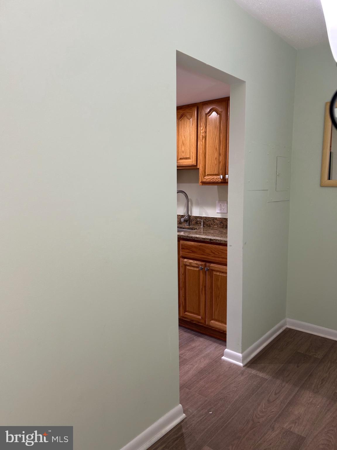 11609 Stoneview Square, Unit 11C Reston, VA 20191 - Photo 10 of 23 a view of a kitchen from a hallway