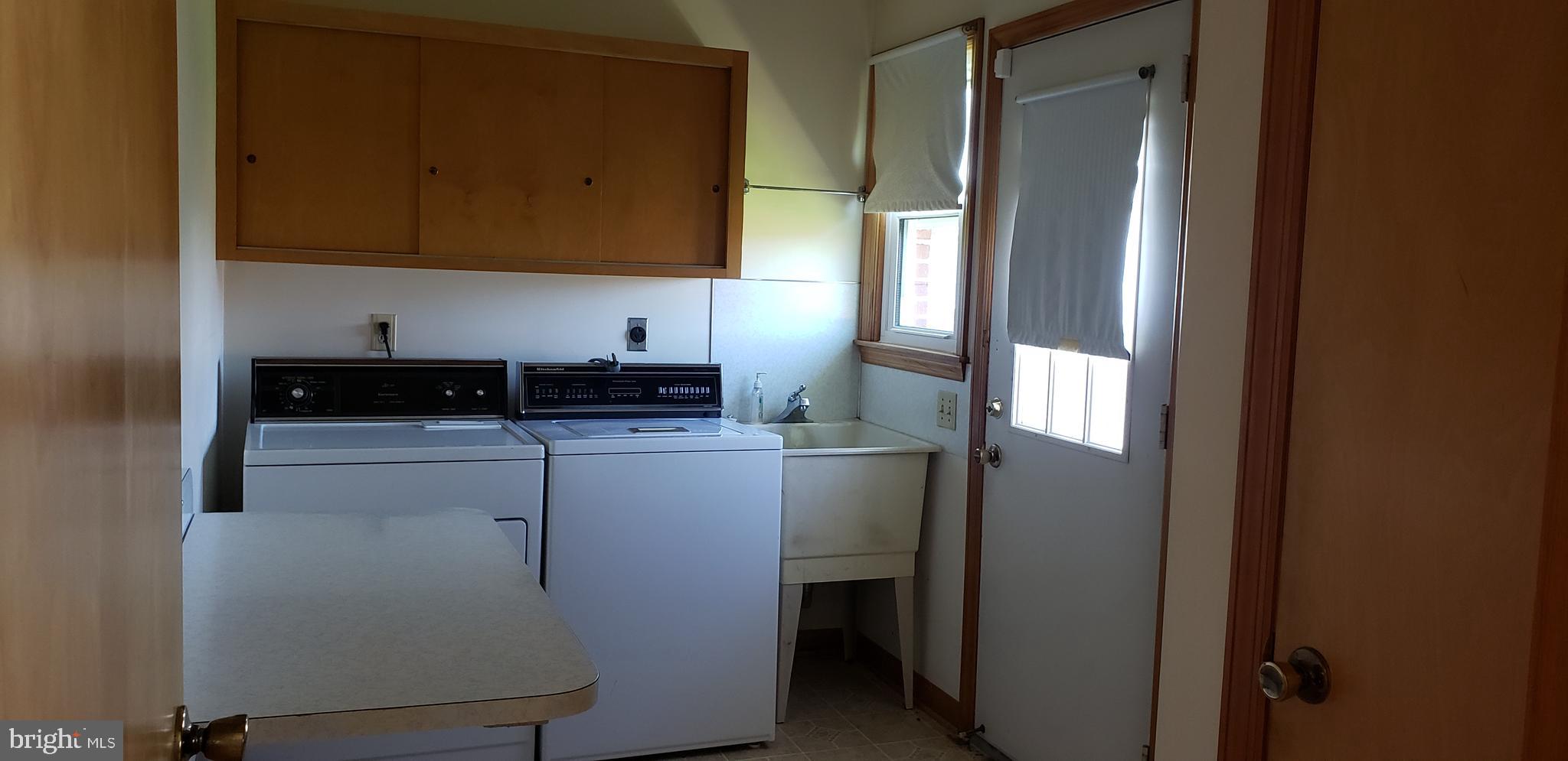 3908 Lander Road Jefferson, MD 21755 - Photo 23 of 44 a kitchen with a refrigerator and cabinets