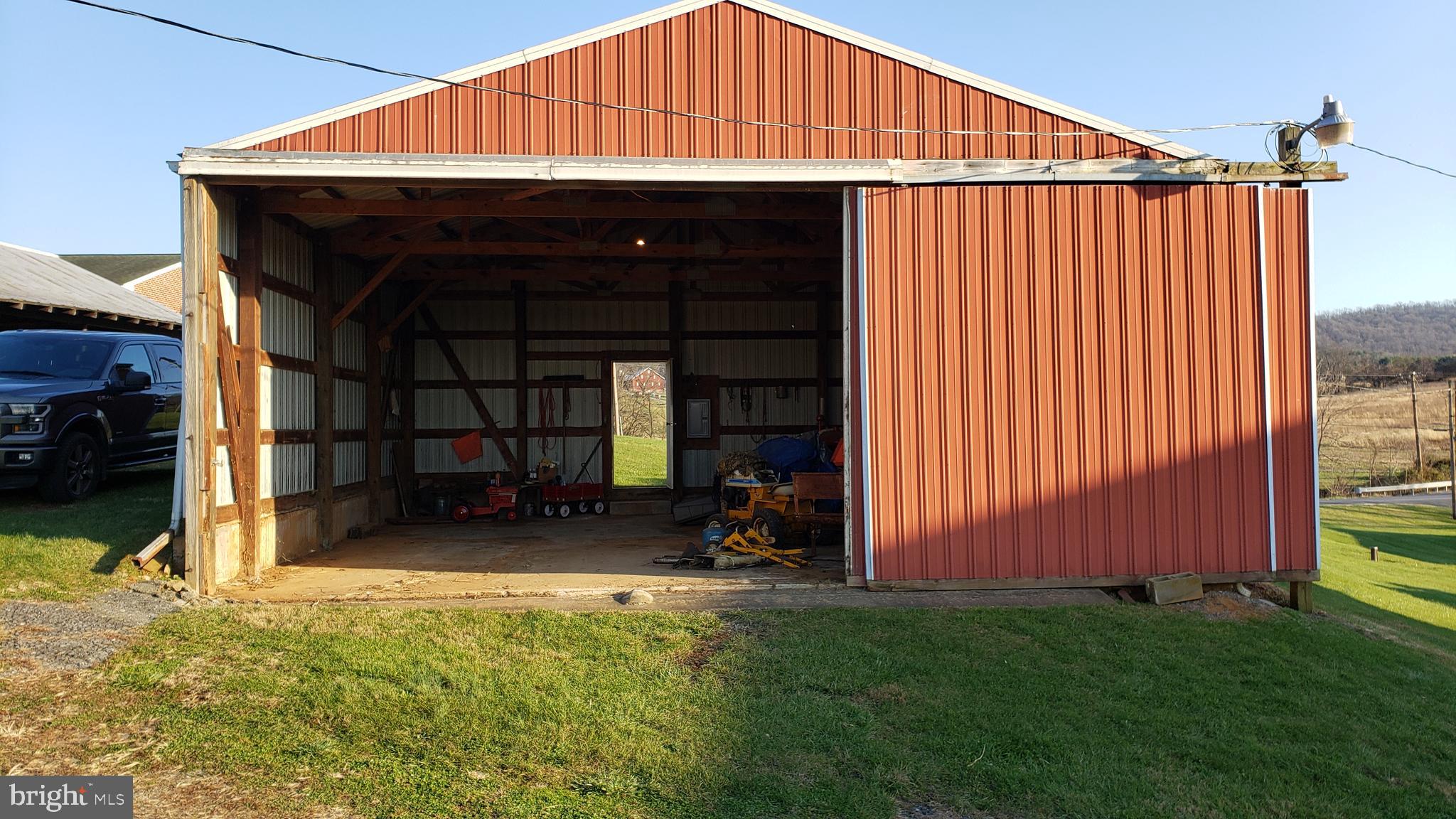 3908 Lander Road Jefferson, MD 21755 - Photo 6 of 44 a view of a small house under an roof deck