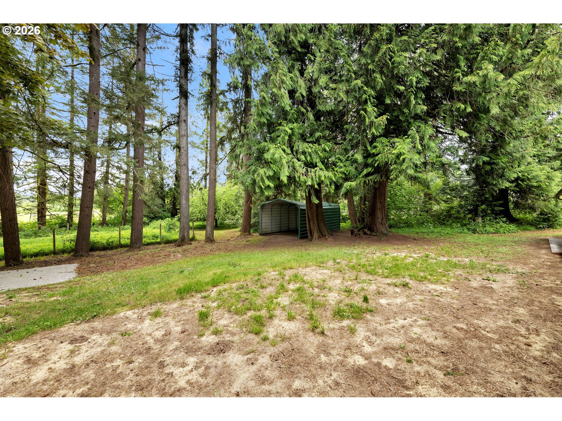 30921 Northwest Spencer Road La Center, WA 98642 - Photo 26 of 39 a backyard of a house with lots of green space