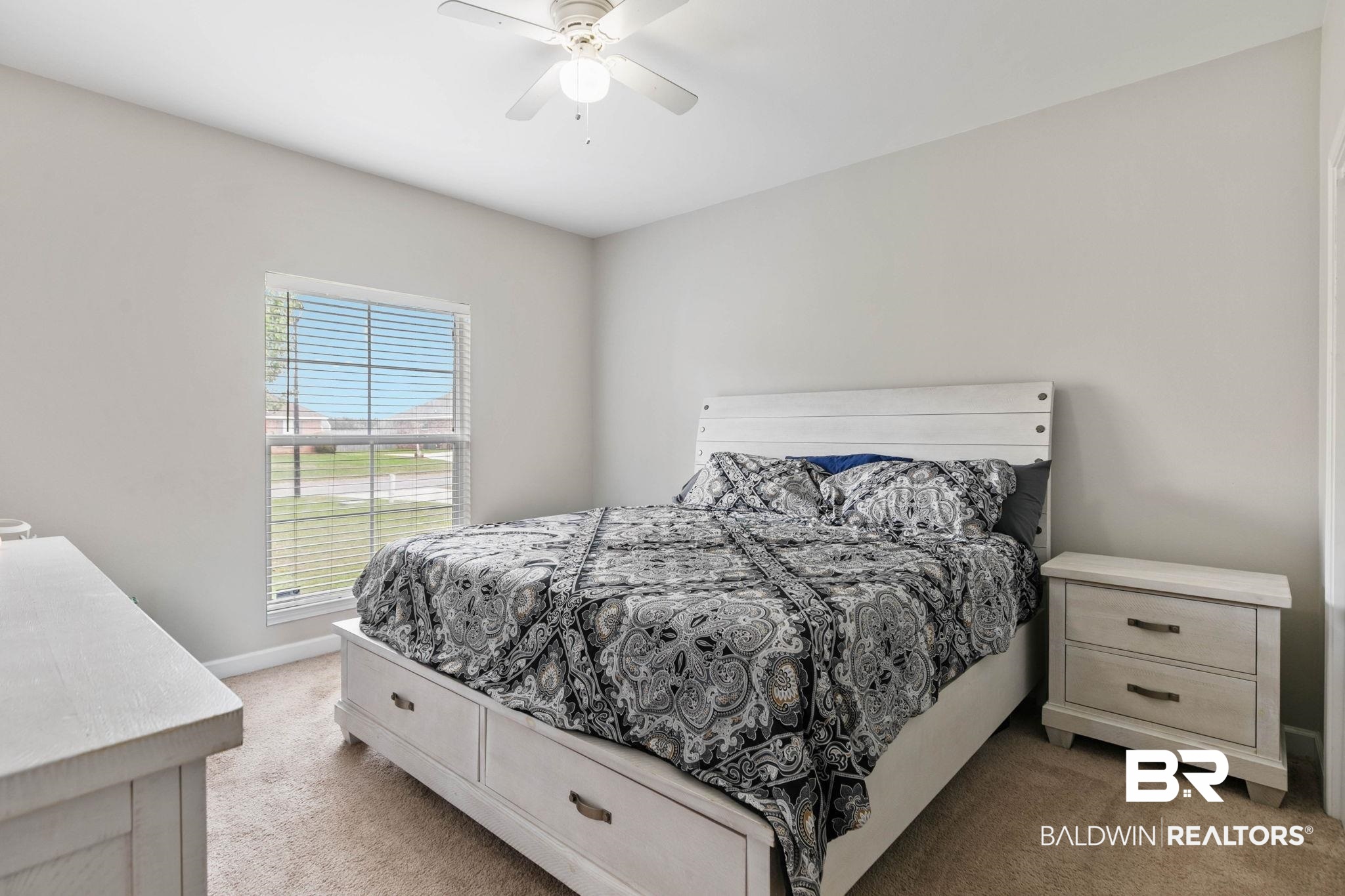 9177 Labrador Trail Theodore, AL 36582 - Photo 14 of 24 Bedroom featuring a ceiling fan and light carpet