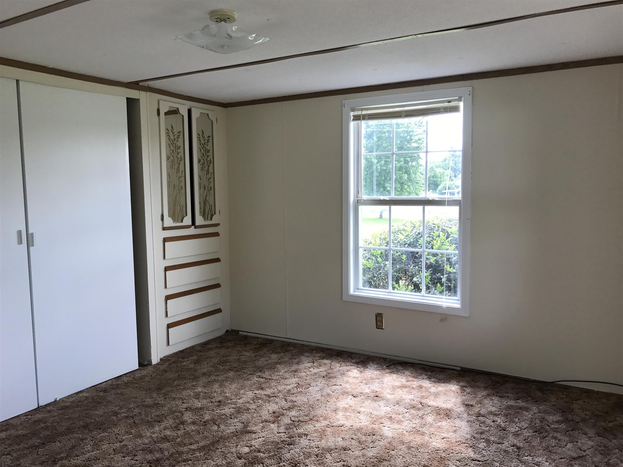 7656 Covington Road White House, TN 37188 - Photo 9 of 14 a view of empty room with windows