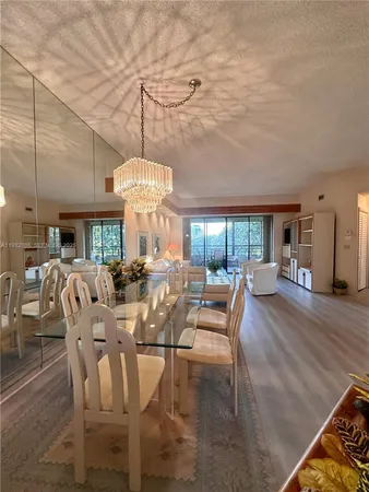 a large kitchen with a refrigerator and a sink