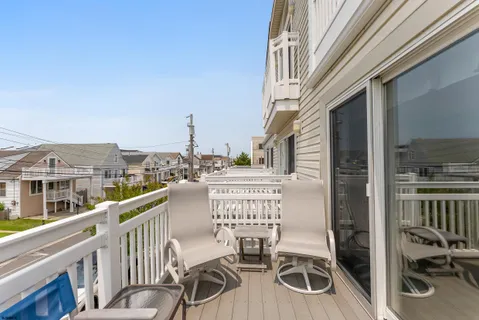 a view of a balcony with chairs