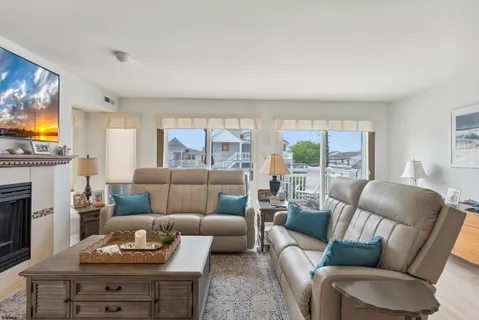 a living room with furniture and a fireplace