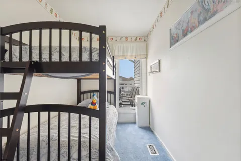 a bathroom with a sink a toilet and a large mirror