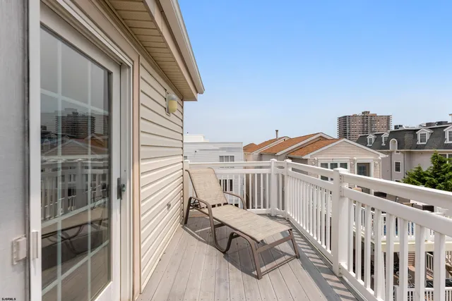 a view of a chair and table in the balcony