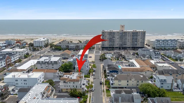 an aerial view of city and lake