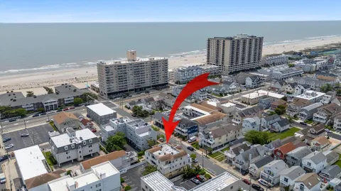an aerial view of a city with ocean view