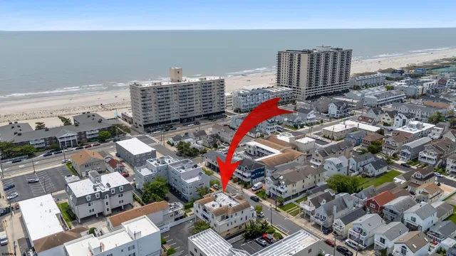 an aerial view of a city with ocean view