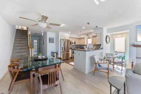 a kitchen with a table and chairs