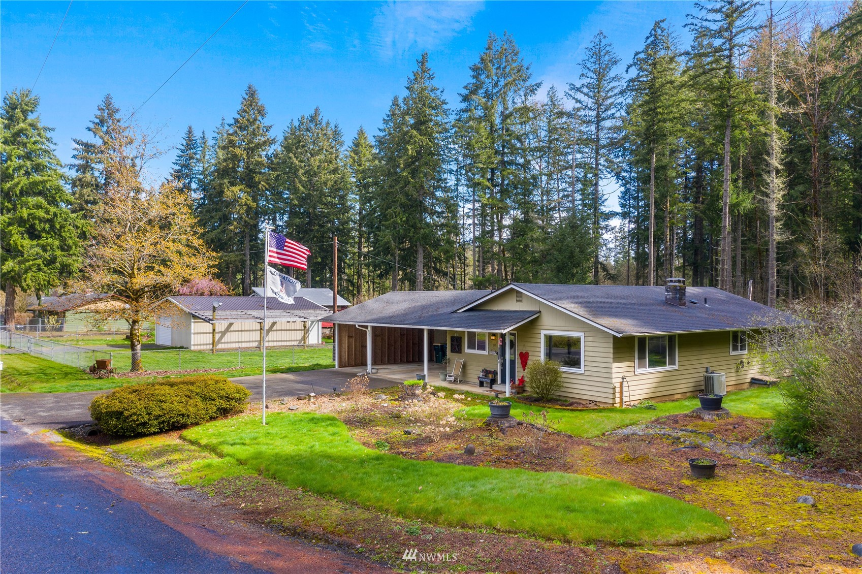 151 Fircrest Road Napavine, WA 98532 - Photo 28 of 28 a view of a white house with a big yard and large trees