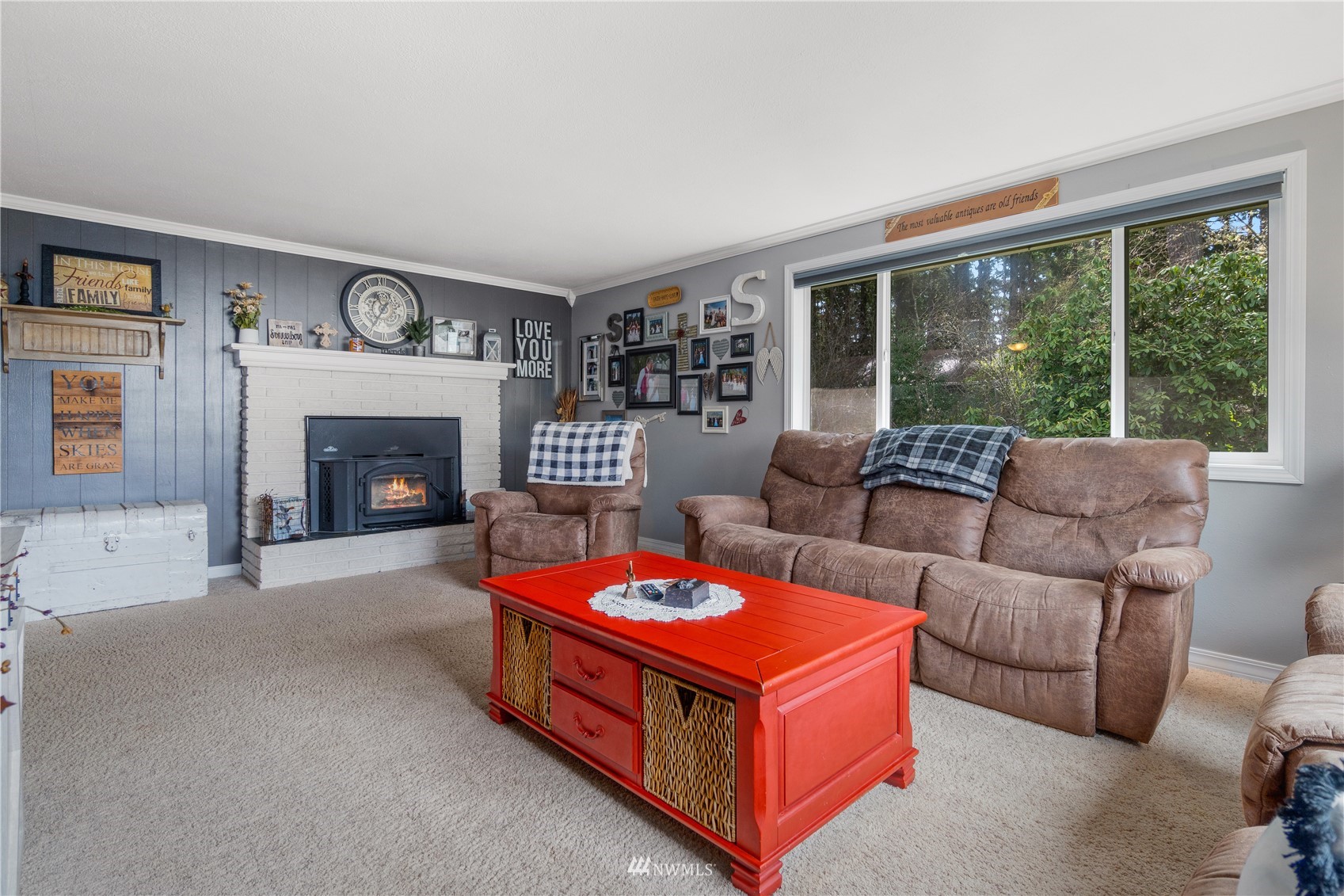 151 Fircrest Road Napavine, WA 98532 - Photo 8 of 28 a living room with furniture a fireplace and a large window