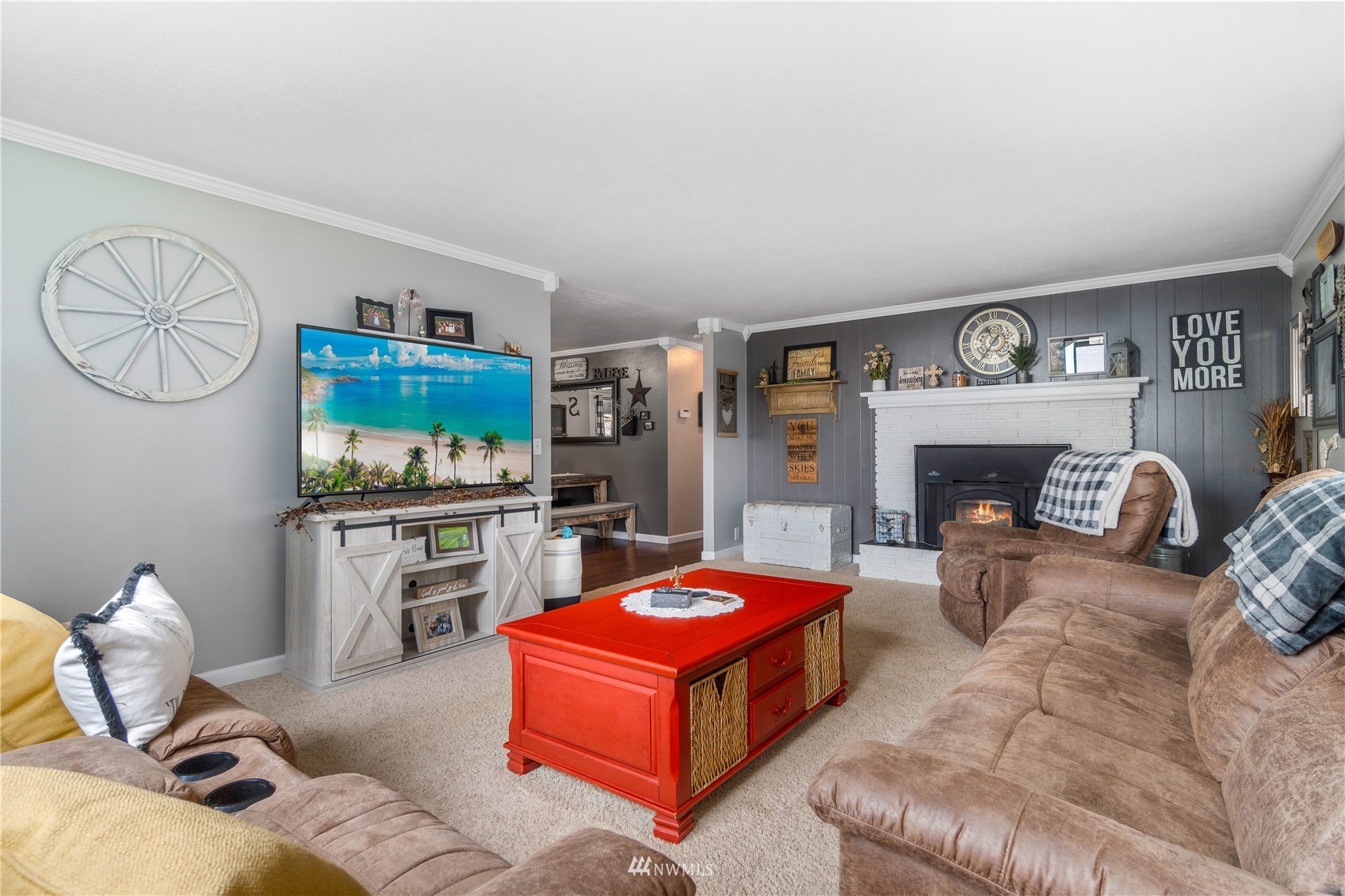 151 Fircrest Road Napavine, WA 98532 - Photo 10 of 28 a living room with furniture a flat screen tv and a fireplace