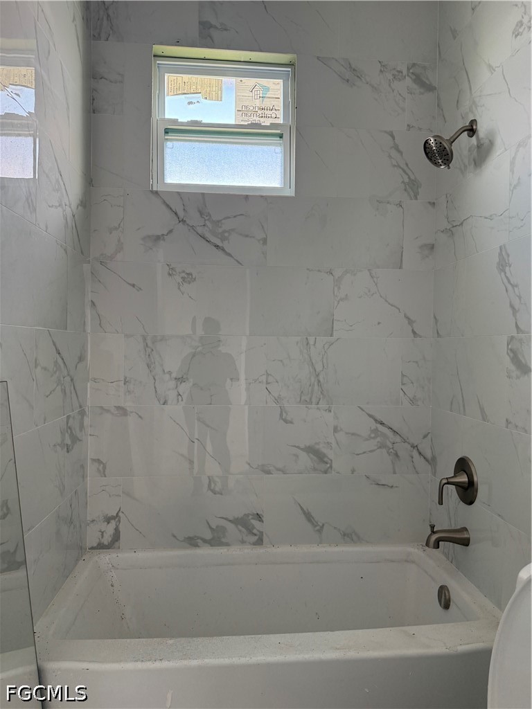 10658 Rainsville Street Port Charlotte, FL 33981 - Photo 15 of 21 a bathroom with a bathtub
