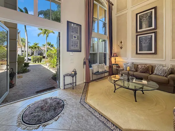 a living room with furniture and a rug