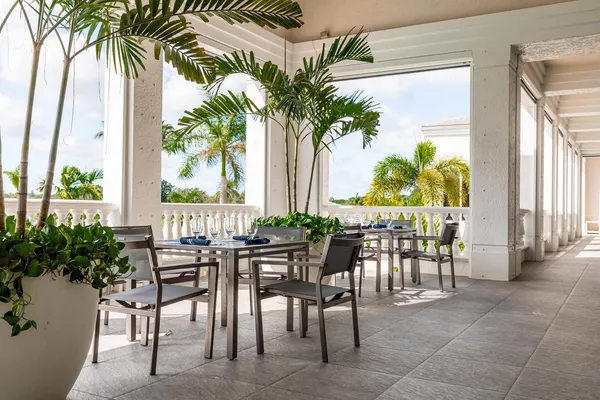 a view of a house with a yard porch and sitting area
