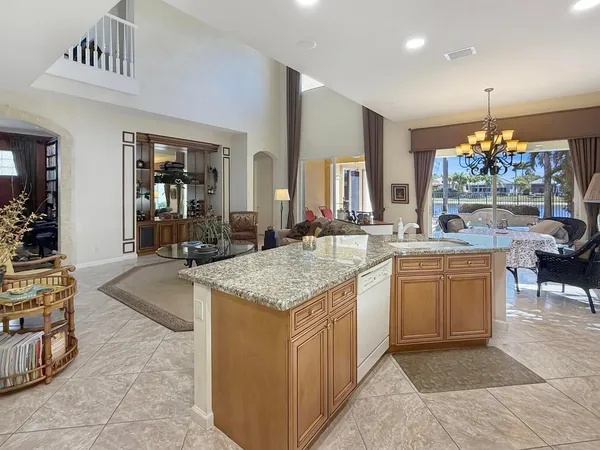 a kitchen with a sink and a refrigerator