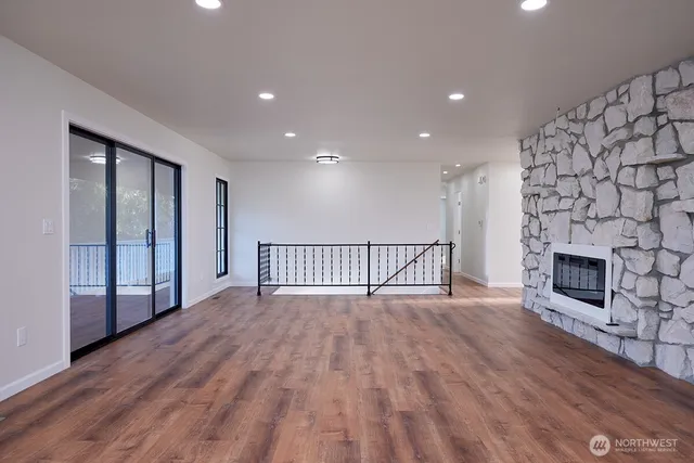 a view of a livingroom with wooden floor