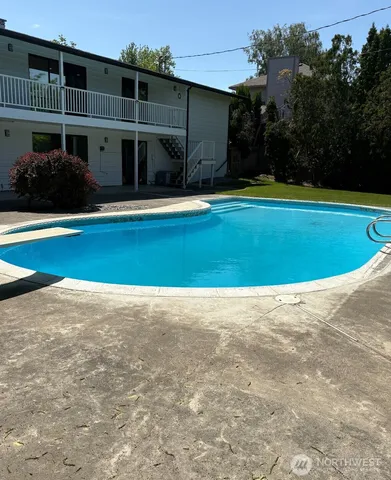 a view of swimming pool in front of building