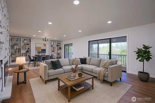 a living room with furniture and a large window
