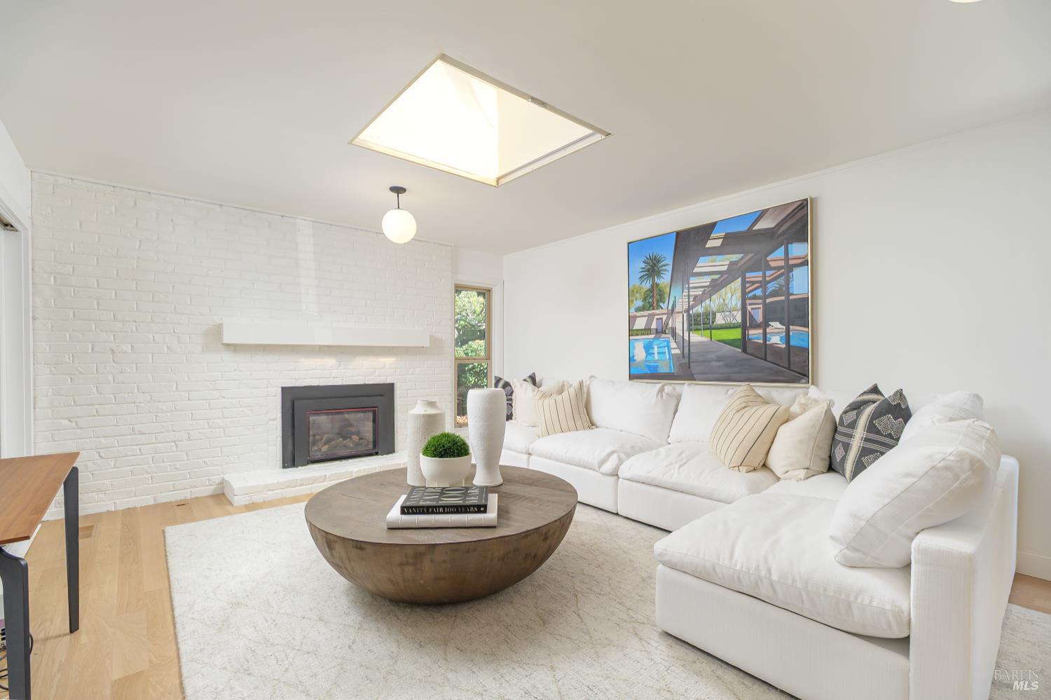 9 Underhill Road Mill Valley, CA 94941 - Photo 14 of 27 a living room with furniture and a fireplace