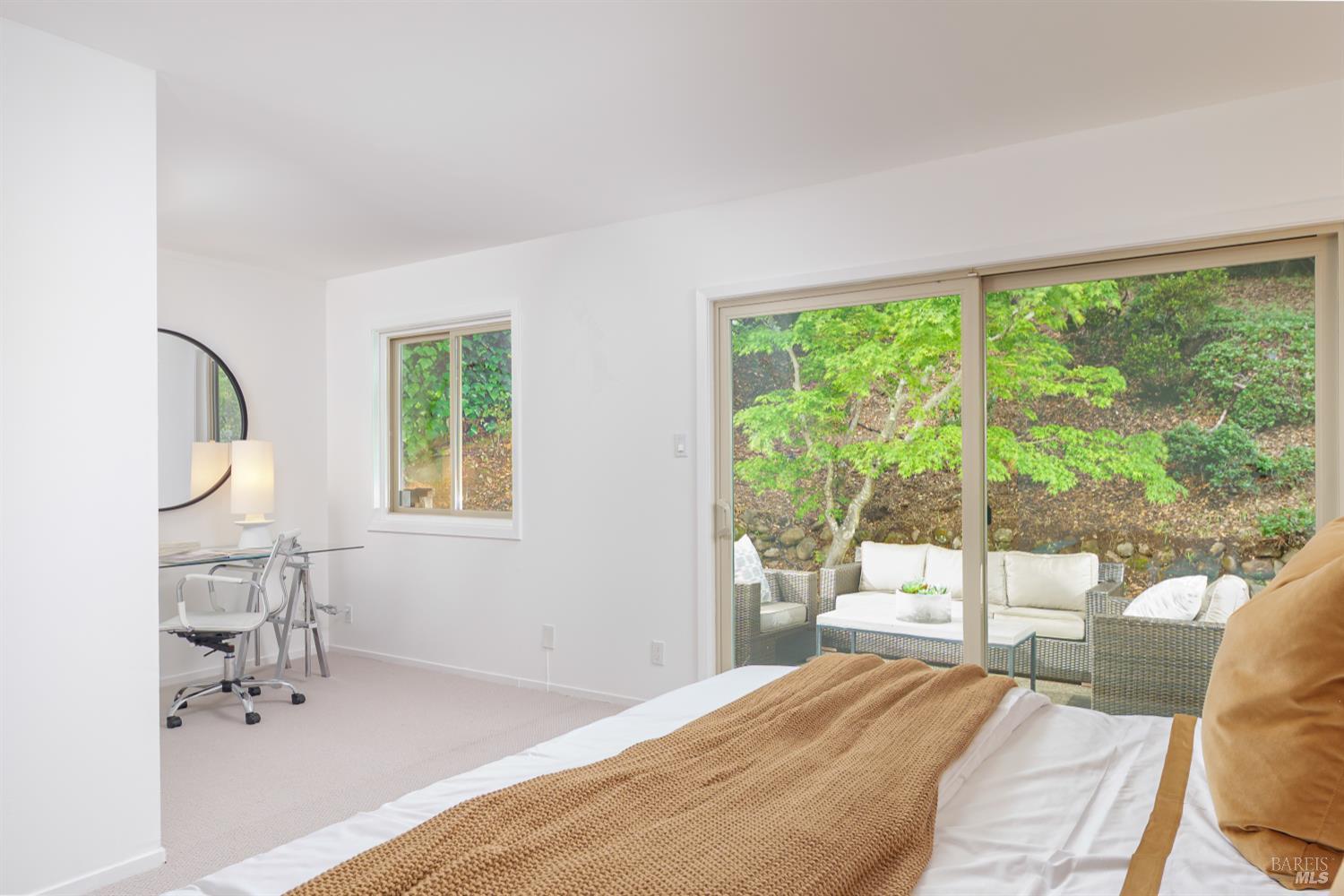 9 Underhill Road Mill Valley, CA 94941 - Photo 16 of 27 a bedroom with a bed and a large window with outer view