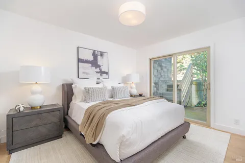 a bedroom with a bed and a chair