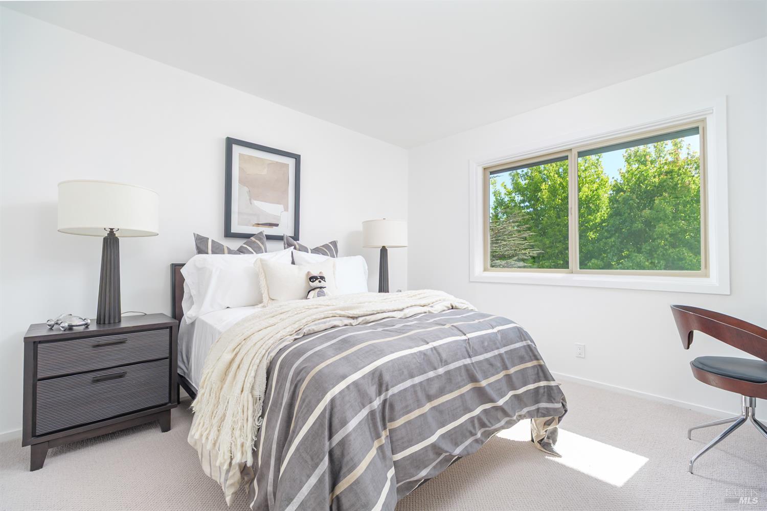 9 Underhill Road Mill Valley, CA 94941 - Photo 18 of 27 a bedroom with a bed and a chair