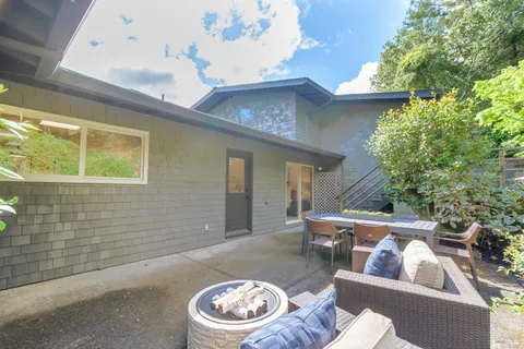 a view of a outdoor sitting area with furniture