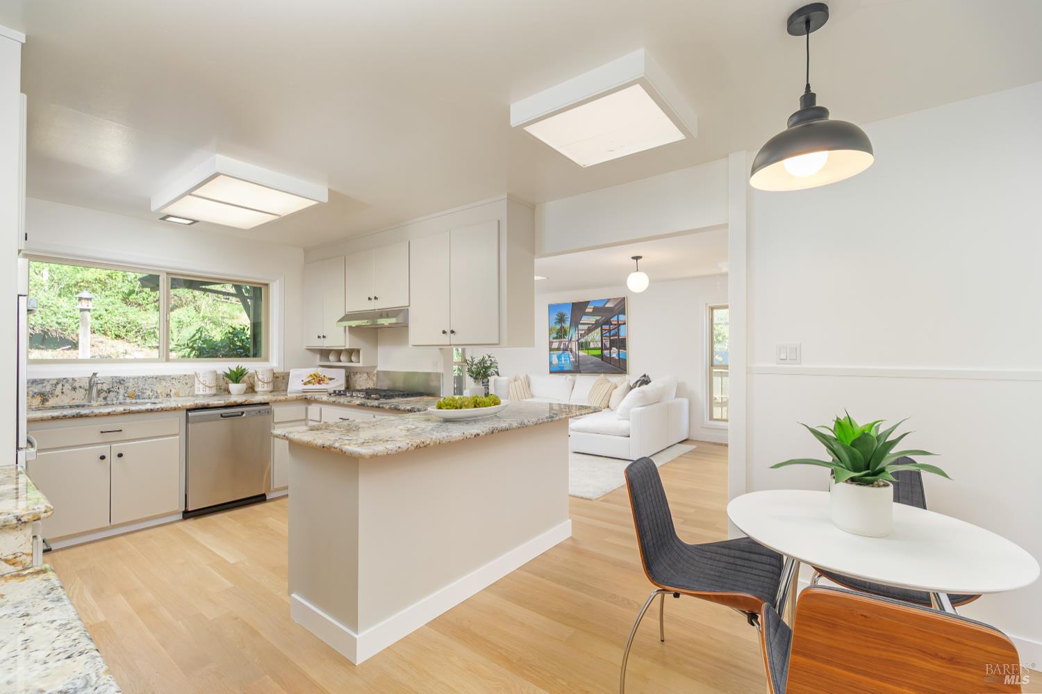 9 Underhill Road Mill Valley, CA 94941 - Photo 10 of 27 a kitchen with kitchen island granite countertop white cabinets and stainless steel appliances