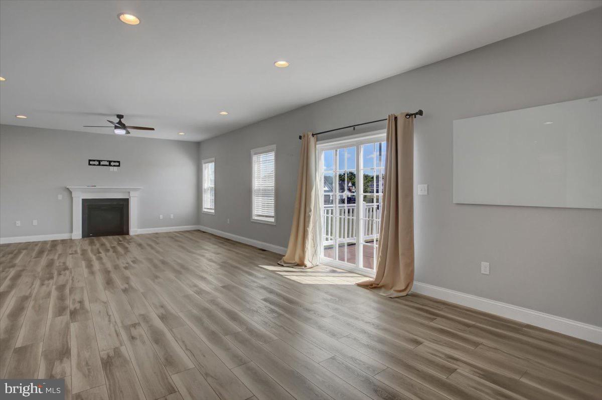 1014 Divinity Drive Greencastle, PA 17225 - Photo 17 of 56 a view of empty room with wooden floor and fireplace