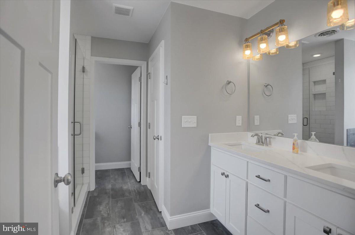1014 Divinity Drive Greencastle, PA 17225 - Photo 25 of 56 a bathroom with a double vanity sink mirror and shower
