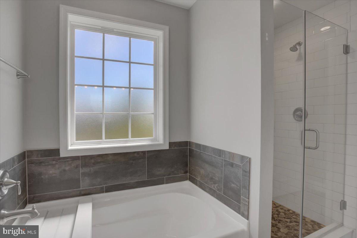 1014 Divinity Drive Greencastle, PA 17225 - Photo 26 of 56 a bathroom with a bathtub and shower