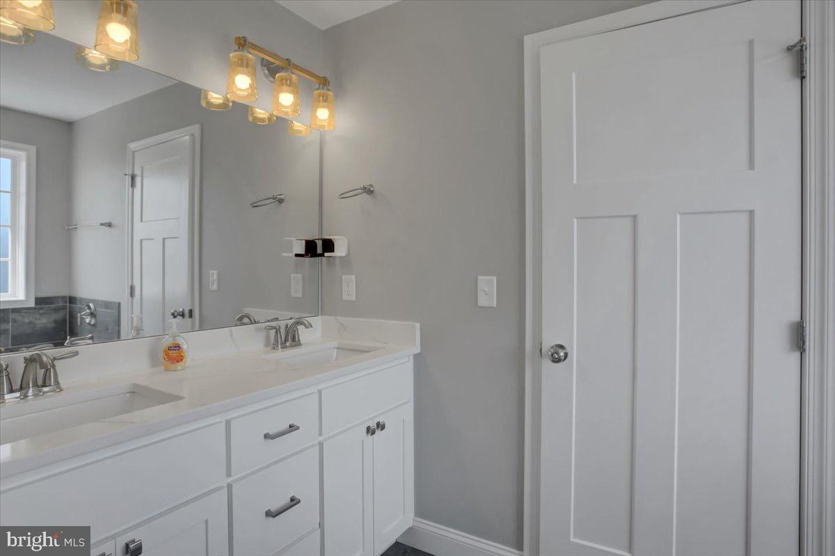 1014 Divinity Drive Greencastle, PA 17225 - Photo 28 of 56 a bathroom with a double vanity sink and a mirror