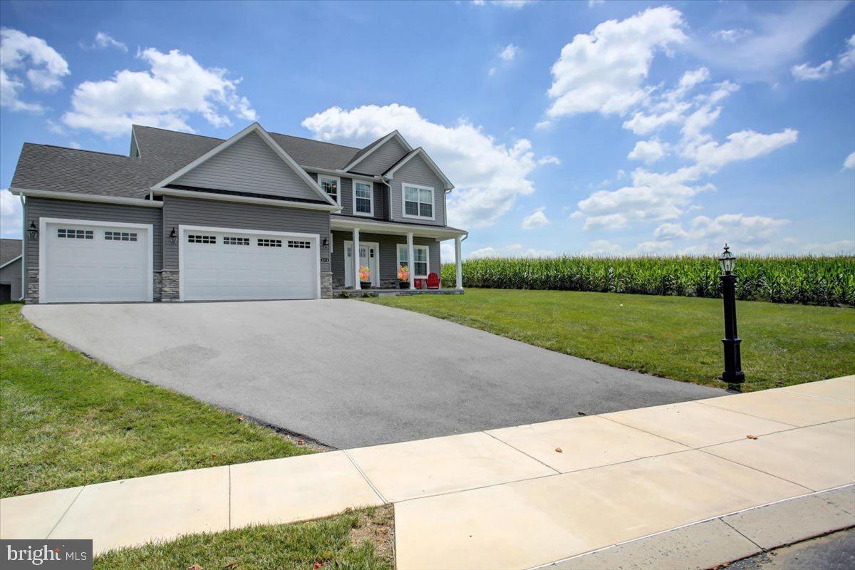 1014 Divinity Drive Greencastle, PA 17225 - Photo 3 of 56 a front view of a house with a yard