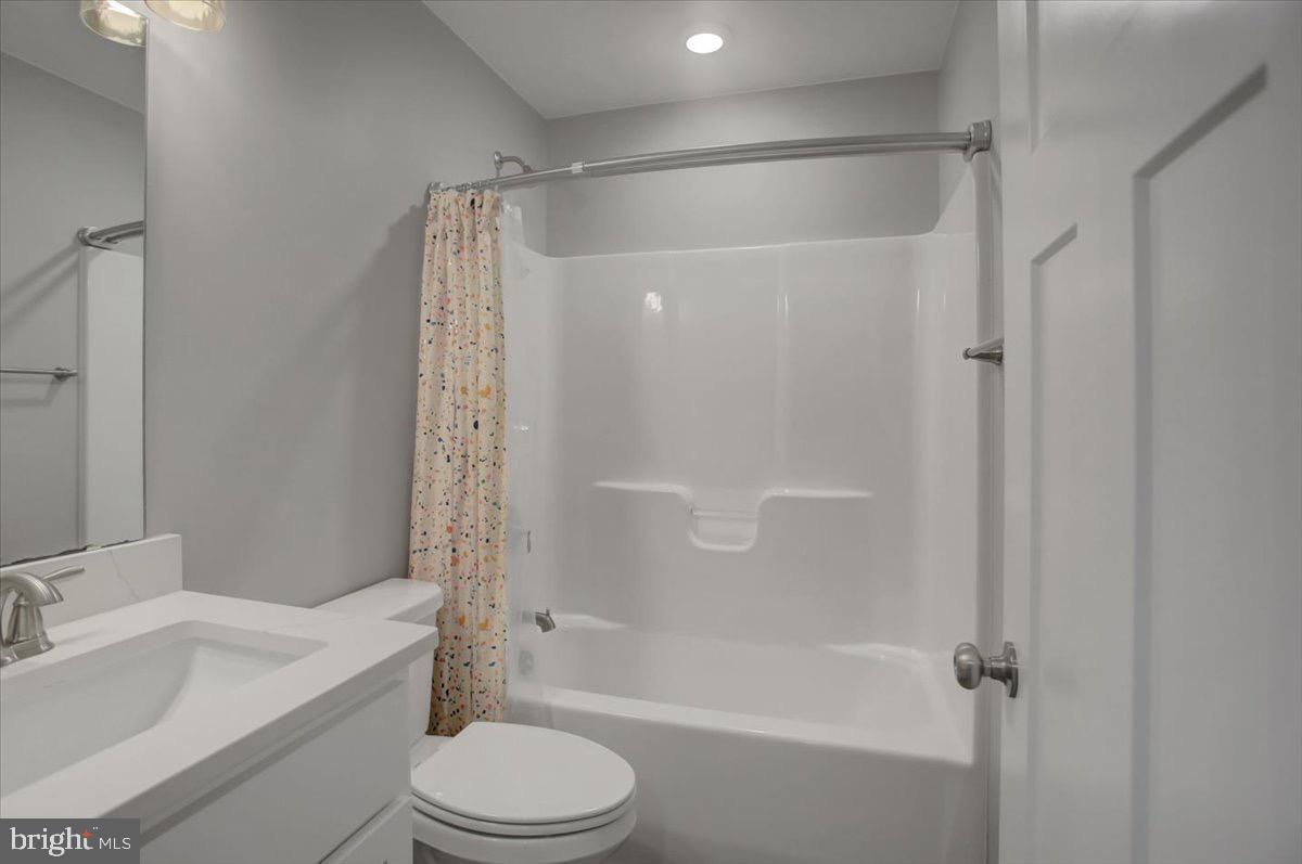1014 Divinity Drive Greencastle, PA 17225 - Photo 34 of 56 a bathroom with a granite countertop bathtub shower sink vanity and toilet
