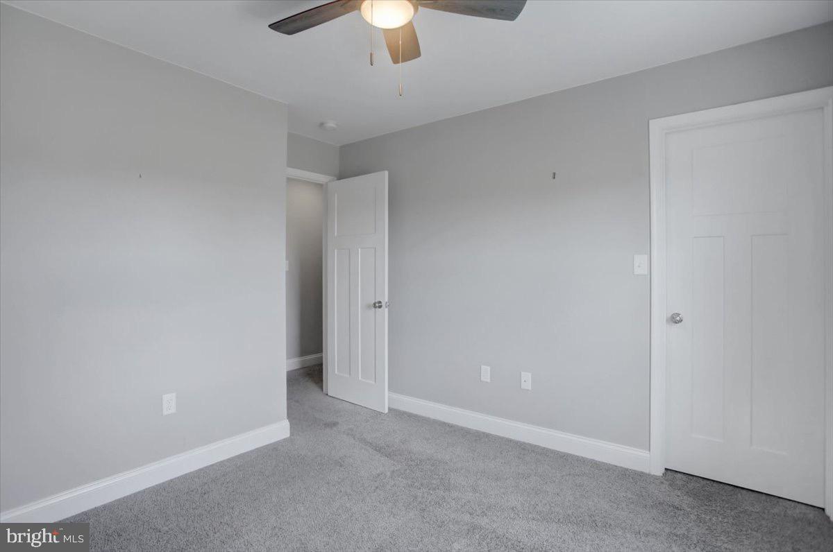 1014 Divinity Drive Greencastle, PA 17225 - Photo 36 of 56 an empty room with a chandelier fan