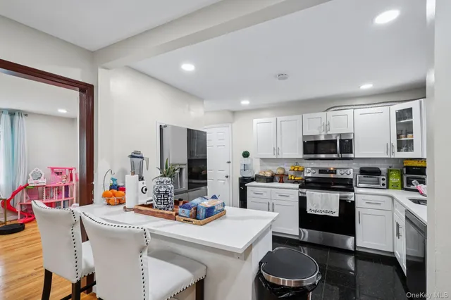 a kitchen with a sink stove and refrigerator
